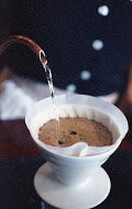 Hario V60 cone shaped disposable paper filters for pour over drippers.